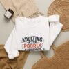 5834965068061244430_2048-1.jpeg Adulting Was Poorly Explained Graphic Sweatshirt | Adulting Humor Unisex Sweatshirt