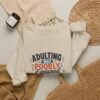 9295772572699249720_2048-1.jpeg Adulting Was Poorly Explained Graphic Sweatshirt | Adulting Humor Unisex Sweatshirt